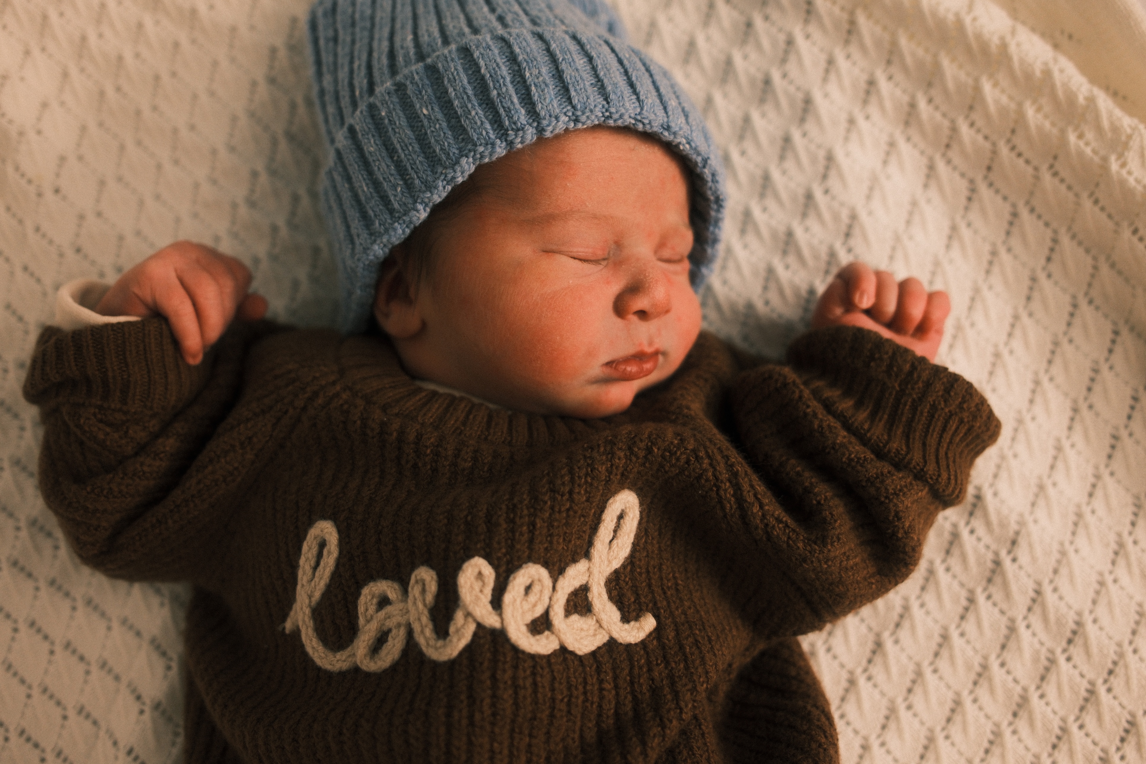 Snuggly newborn naps of baby Robin.